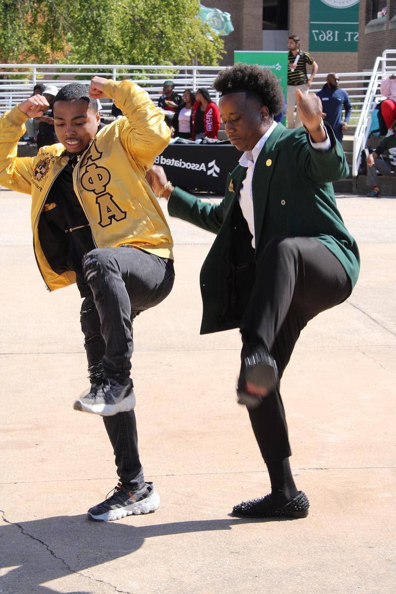 Two students dancing